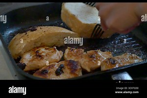 frying meat in a pan 4k