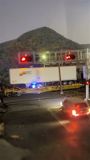 A trailer train has a mismatch pair of GP40-2’s on the Marcusville Main.