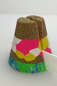Cutting a multi-layer kinetic sand cone