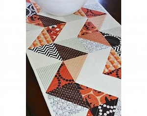 This charming runner is reversible, with a different design on each side. Make one side seasonal and the other to enjoy all year (or a different season on each side!). Get the pattern here: http://quiltingdigest.com/this-charming-runner-is-reversible/ | Quilting Digest