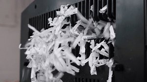 Paper Shredder Machine. Shredded secret documents. Office Cross Cut Paper Shredder