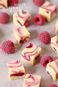 White Chocolate Raspberry Fudge Ingredients: - 2 cups white chocolate chips - 1 can (14 oz) sweetened condensed milk - 1/2 cup fresh raspberries - 1 teaspoon vanilla extract - 1/4 cup raspberry puree (optional for swirls) - Pinch of salt Instructions: 1. Line an 8x8 inch baking dish with parchment paper. 2. In a saucepan over low heat, combine white chocolate chips and sweetened condensed milk. Stir until melted and smooth. 3. Remove from heat and add vanilla extract and a pinch of salt. 4. Gent