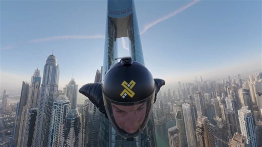 Skydivers fly through world’s tallest hotel