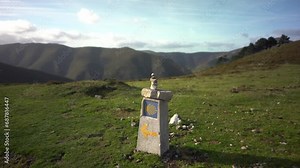 Camino de Santiago yellow arrow shell sign showing way to Compostela