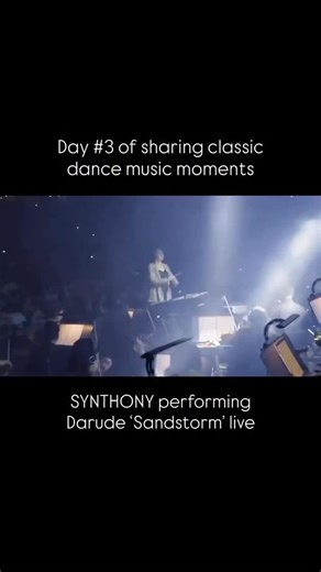 DJ Mag on Instagram: "Darude’s ‘Sandstorm’ was brought to life with a full orchestra in Melbourne 🎺 The 2022 performance formed part of SYNTHONY’s concert series reimagining electronic music hits through orchestral arrangements. Originally released in Finland in October 1999 and reissued worldwide in 2000, ‘Sandstorm’ quickly became a global phenomenon. The track’s unforgettable 16‑note synth melody, created on a Roland JP‑8080, propelled it to the top of dance charts across Europe and the US, 