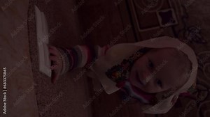 the child reaches for the switch and turns the light on and off, the baby plays with the switch in the room, turning the light on and off