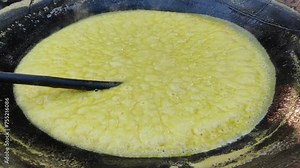 Traditional Jaggery Production: Sugarcane Juice Boiling in Pan