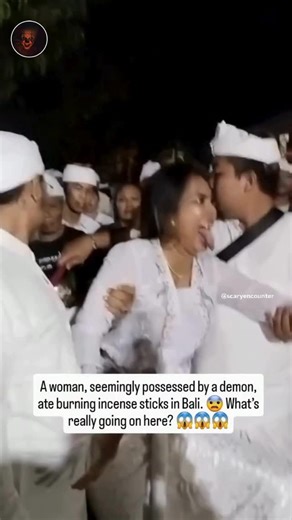 Haunting Clips | Conspiracy on Instagram: "They told us possession was just myth… but some things can’t be explained away. Here’s what they don’t tell you: ✅ In Bali, a woman was filmed eating burning incense sticks during a sacred ritual—completely unfazed by the flames. ✅ Locals believe she was overtaken by a spirit or demon, as her body twisted and her eyes rolled back. ✅ Science calls it “trance states” or hysteria… but why do the same manifestations appear in cultures across the world, cent