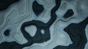 Ice landscape melting ocean from above climate change background loop seamless