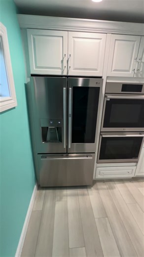 Thinking of sunnier days with this beautiful painted red oak pool house kitchen with quartz countertops. Installed in Fort Gratiot, MI | Lakeside Kitchen And Bath