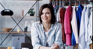 Beautiful Young Female Vlogger or Blogger is smiling to the Camera. Young Freelance Woman is working on Freelance, working as Stylist, Beauty Blogger. Freelance Woman is enjoying her Lifestyle.