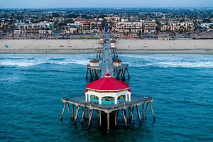 This Town Is Known As ‘Surf City USA’—With Dog Surfing, Oceanfront Hotels, and Some of California’s Best Fish Tacos