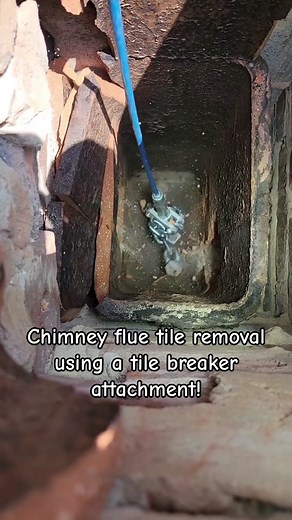 Using a dewalt drill and a tole removal attachment to break up tile inside of the chimney! #milwaukeetools #dewalttools #ryobitools