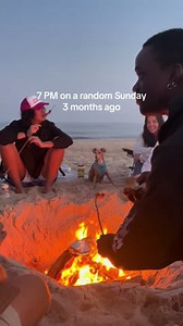 Summer beach bonfire with friends before the early sunsets