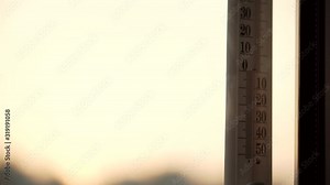 Alcohol Thermometer On Window Showing Outdoor Temperature In Autumn Day Close Up. View Of The Thermometer Through The Window.Temperature Outside Window In Fall.