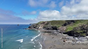 4K aerial footage of north cornwall coastline showing cliffs beaches rocks sea and surf