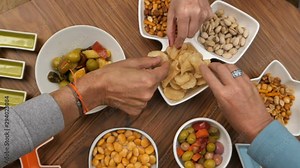 happy, together, group, eating, snack, food, friends, evening, friendship, sitting, fun, people, party, person, celebration, having fun, enjoyment, drink, chips, snacks, olive, hands, close up, aperit