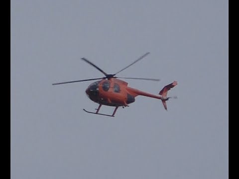 Red Hughes Helicopter Buzzing House