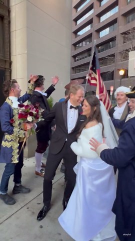 Group dressed in colonial clothing crash bride and groom's photoshoot