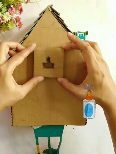 How to hang a DIY Cuckoo Clock on the wall #cardboardcraft #diy #cardboardhouse #cardboardclock