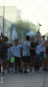 Argentina young people celebrating Argentina Football Team Victory while walking and singing in the streets. South American Culture concept