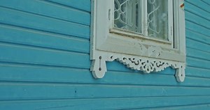 Antique wood carvings, wooden trim on the windows of the house. Wooden lace, national patterns on wood, customs and traditions of architecture and decorations of buildings. 4k, ProRes