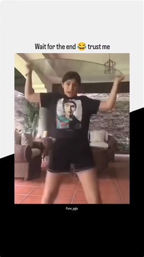 PURE PAGLU on Instagram: "Wait for the end 😂 trust me This Instagram Reel taps straight into a universal nerve of relatable, high-energy mishaps. The clip captures a moment of pure, unfiltered chaos: a young woman dancing and belting out Shakira’s “Waka Waka” wildly off-key on a patio, before abruptly hoisting a glass tabletop above her head and attempting to slide beneath it to hide. The plan goes sideways instantly. Instead of disappearing, she wedges herself awkwardly between the tabletop an