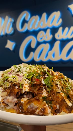 Our Birria Loaded Nachos are an Azteca favorite 🔥 Homemade chips, melted cheese, queso fresco, beans, lettuce, salsa verde, Mexican crema topped with birria meat. | Azteca Cocina Mexicana