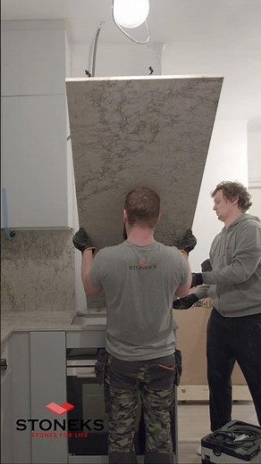 Wow! Watch us install this high Caesarstone wall panel. 🛠️