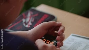 The guy in counts on the calculator and puts the results in the table.