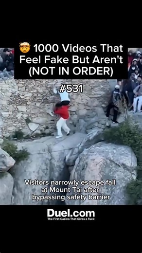 Surreal Footage on Instagram: "On May 4, 2025, a Chinese couple visiting Mount Tai in Shandong Province narrowly escaped a fatal fall after bypassing a safety barrier to avoid long tourist queues. Attempting to scale a steep cliffside, the man helped the woman over an artificial wall, but she lost her balance, causing both to tumble toward the precipice. Miraculously, the man managed to grab a safety wire and wedge himself into a rock crevice, preventing a fatal drop. He then held onto the woman