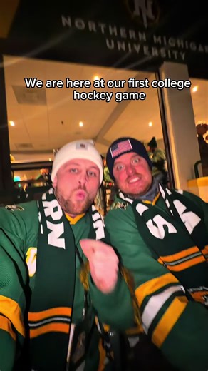 Exciting Rivalry at College Hockey Game in Michigan