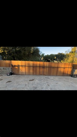 “Elegant, sturdy, and modern”! 😎 A wooden style sliding driveway gate not only adds curb appeal but also delivers long-lasting performance and enhanced security for your property with the proper gate operator! 🔐 Call us 📞 818-765-3636 #gateautomation #fyp #homesecurity #wooddesign #homeimprovement #accesscontrol | Automated Gate Supply