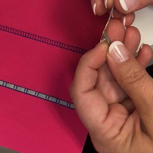 Select a ladder stitch if your machine has it. Place stabilizer behind the fabric. Sew the desired length of ladder stitch and then use a bodkin or large needle to thread a ribbon over and under through the ladder stitches as desired! #singersewingmachine #singersewingcompany #itstartswithastitch #ladderstitches #isew #sewingtips #tipsandtricks | Singer North America