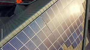 Aerial view of a new modern castel church with a blue shiny solar photovoltaic panel system on the roof. Renewable ecological green energy production concept. Gdansk Poland Stock Video