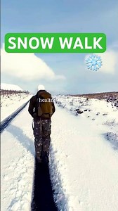 Walking through the snowy mountains of Wales.