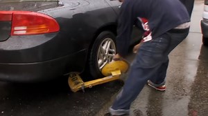 'Only got one ticket,' man cries as he pulls boot off car - the cops got called