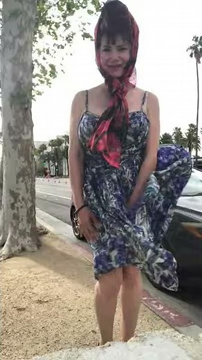 windy day and laughing fighting it!