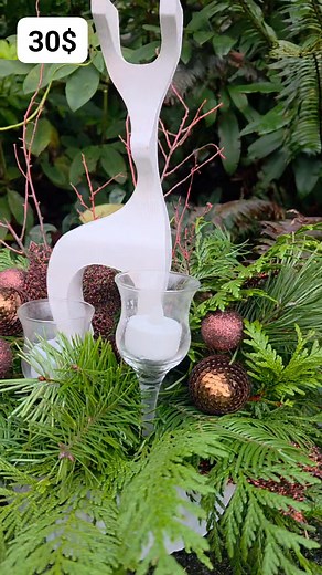 Fragrant display w 2 glass stand votives a homemade carved reindeer in a white plastic base. Burgandy highlights 30$ | Christmas Centerpieces