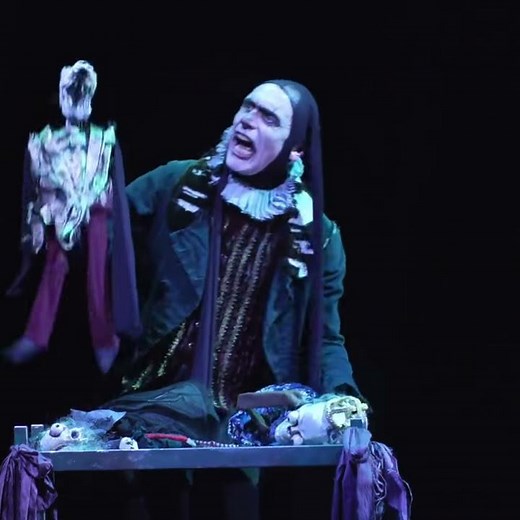 How is puppetry used in The Grinning Man?