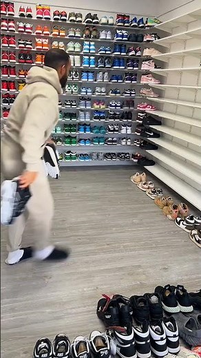 Person is organizing their impressive sneaker collection!