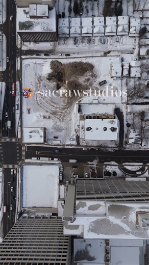 Aerial Top Down View Snow Covered Urban City Block Winter Traffic