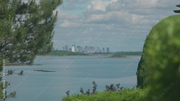 Boston city skyline as seen from across the water. Hingham, MA, USA.