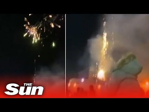 Families run screaming after fireworks shot into CROWD
