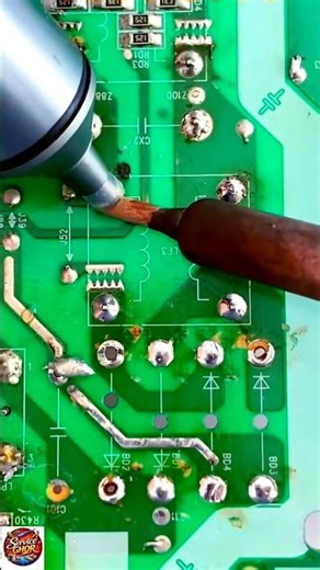 The video shows a person using an ultrasonic welding or high-frequency soldering tool on a printed