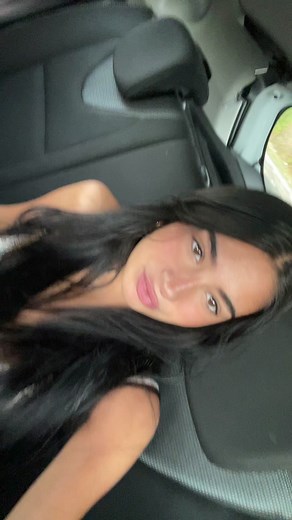 Stylish Car Journey with Long Hair and Manicured Nails