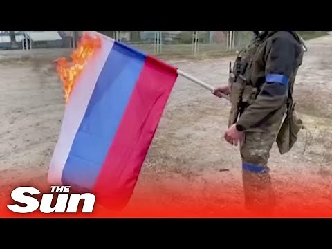 Ukrainian soldiers burn Russian flag in Vovchansk as they regain territory