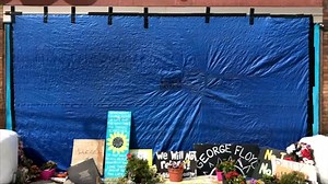 George Floyd mural in Minneapolis defaced with black paint, covered with tarp