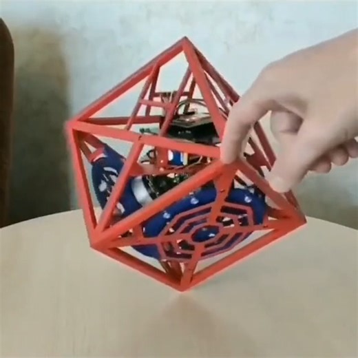 MECATRÓNICALATAM on Instagram: "Cubo de Reacción (o Momentum Cube): 🧠 ¿Cómo funciona? Dentro de esta estructura roja, hay tres motores con discos metálicos llamados "volantes de inercia" o reaction wheels. Sensores de precisión: El robot tiene giroscopios y acelerómetros (similares a los de tu celular) que detectan hacia qué lado se está cayendo en milisegundos. Acción y Reacción: Cuando el cubo siente que se inclina, los motores giran los discos a altísimas velocidades. Según la Tercera Ley de