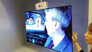 10M views · 1K reactions | Finally, a better way to watch two shows at once! Check out this amazing, razor thin double sided TV from LG. #CES2016 | Rich DeMuro | Facebook